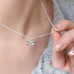 Chic Bow Choker - Elegant Silver Necklace with Delicate Pendant